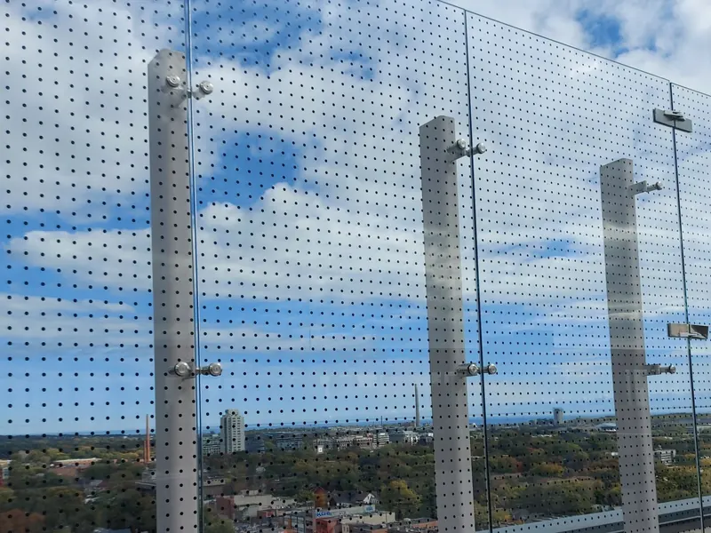 Glass balcony railing with dotted bird deterrent film