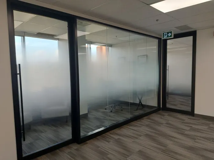 Glass office walls finished with 3M FASARA film